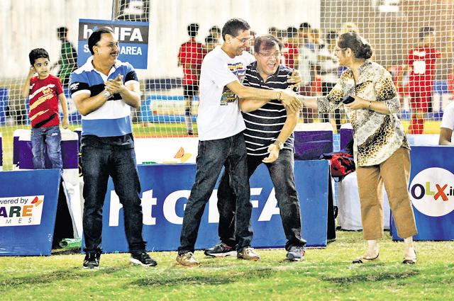 Parents enjoy a light moment during Saturday’s action. (Abhinav Saha/HT Photo)