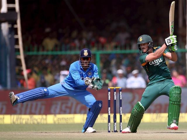 South Africa's Faf du Plessis plays a shot as Dhoni watches. (Reuters Photo)