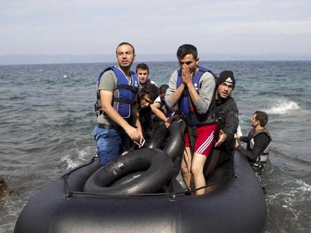 Afghan refugees arrive on a dinghy on the Greek island of Lesbos, after crossing a part of the Aegean Sea from the Turkish coast. (Reuters) Afghan refugees arrive on a dinghy on the Greek island of Lesbos, after crossing a part of the Aegean Sea from the Turkish coast. (Reuters)