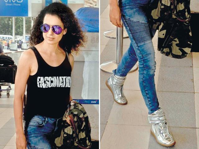 Kangana Ranaut pairs her  lacy sports shoes with skinny denims. (yogen shah/HT) 