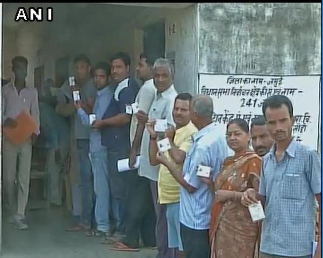 Voters queue up outside a polling station in Jamui, Bihar (Photo courtesy : @Ani_news)