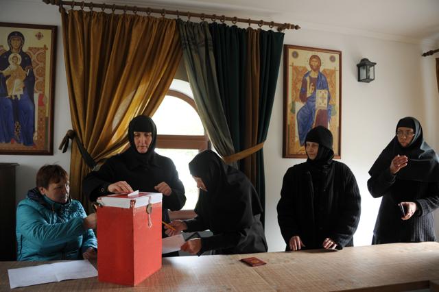 A Belarus' Orthodox nuns vote during presidential elections in the village of Bogushi. (AFP Photo) A Belarus' Orthodox nuns vote during presidential elections in the village of Bogushi. (AFP Photo)