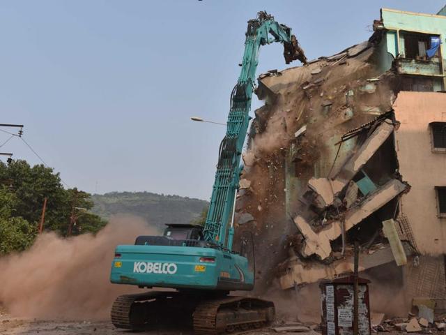 A bulldozer pulls down an illegal building in Digha last week. (Bachchan Kumar) A bulldozer pulls down an illegal building in Digha last week. (Bachchan Kumar)