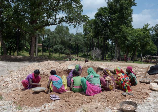 Labourers collect mica at a scrap mine in Koderma district. (AFP) Labourers collect mica at a scrap mine in Koderma district. (AFP)