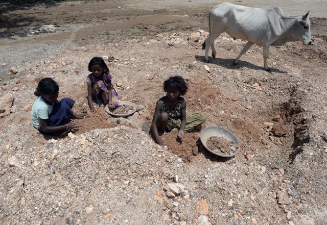 Deaf child labourer Nagina (C) and others collect mica at a scrap mine in Koderma district , Jharkhand. (AFP) Deaf child labourer Nagina (C) and others collect mica at a scrap mine in Koderma district , Jharkhand. (AFP)