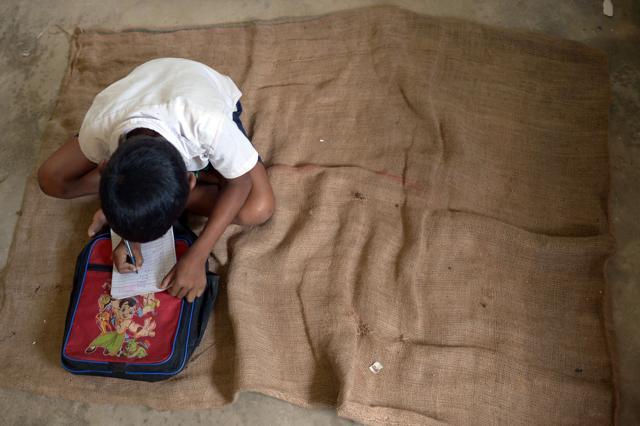 Schoolchild attends class in Koderma District. (AFP) Schoolchild attends class in Koderma District. (AFP)
