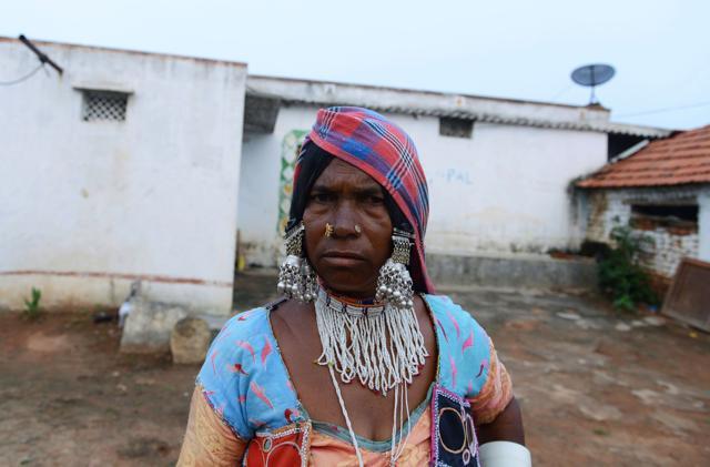 Widow Kurra Sakri, who lost her husband in a road accident, stands in front of her home in the village of Peddakunta. (AFP) Widow Kurra Sakri, who lost her husband in a road accident, stands in front of her home in the village of Peddakunta. (AFP)
