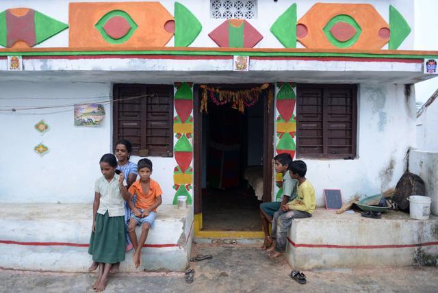 Tribal widow P Lalitha (2nd L), who lost her husband in a road accident, sits along with her children. (AFP) Tribal widow P Lalitha (2nd L), who lost her husband in a road accident, sits along with her children. (AFP)