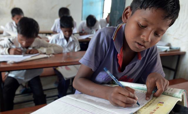 School children attend class at Koderma District. (AFP) School children attend class at Koderma District. (AFP)