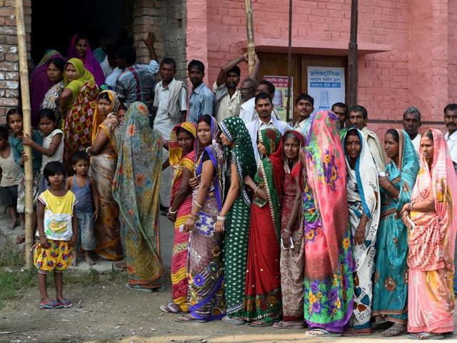 Voters assemble to cast their votes at a centre in the village of Banbira in Samastipur district on October 12, 2015. (AFP)