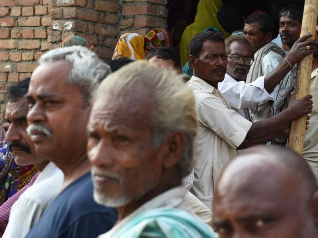 Voters queue to cast their ballots in the village of Banbira in Samastipur district. (AFP)