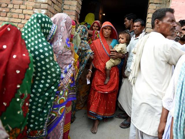 A voter leaves after casting her ballot in the village of Banbira in Samastipur district. (AFP)