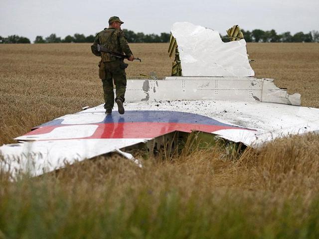 An armed pro-Russian separatist stands on part of the wreckage of the Malaysia Airlines Boeing 777 plane after it crashed in the Donetsk region, Ukraine.(Reuters File Photo) An armed pro-Russian separatist stands on part of the wreckage of the Malaysia Airlines Boeing 777 plane after it crashed in the Donetsk region, Ukraine.(Reuters File Photo)