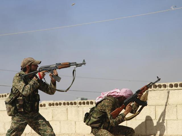 In this photo taken on Sunday, October 11, 2015, Syrian soldiers fire repelling an attack in Achan, Hama province. (AP) In this photo taken on Sunday, October 11, 2015, Syrian soldiers fire repelling an attack in Achan, Hama province. (AP)