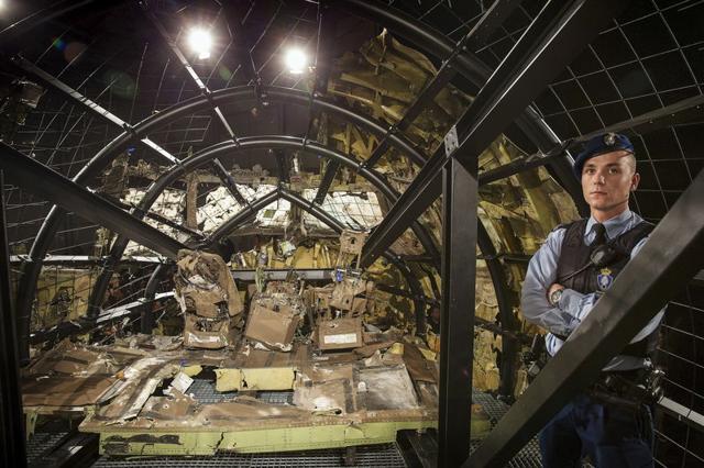 A military policeman stands guard in the cockpit of the MH17 airplane after the presentation of the final report into the crash of July 2014 of Malaysia Airlines flight MH17 over Ukraine in Gilze Rijen, the Netherlands. (REUTERS) A military policeman stands guard in the cockpit of the MH17 airplane after the presentation of the final report into the crash of July 2014 of Malaysia Airlines flight MH17 over Ukraine in Gilze Rijen, the Netherlands. (REUTERS)
