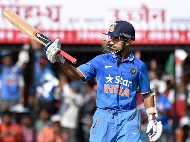 India's Ajinkya Rahane celebrates his half century. (PTI Photo)