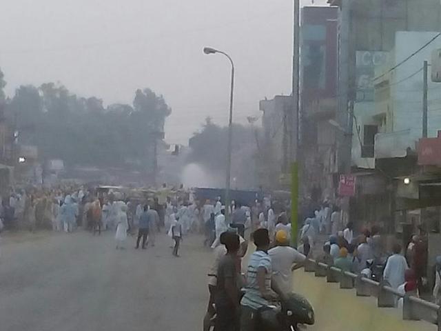 Police used batons and water cannons to disperse protesters in Kotkapura town of Faridkot district. (Sanjeev Kumar/HT Photo)