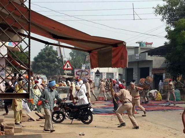 Police used batons and water cannons and fired in the air to disperse members of Sikh groups who gathered in Kotkapura town of Faridkot district early on Wednesday to protest the act of sacrilege in Bargari village. (Sanjeev Kumar/ Ht Photo)