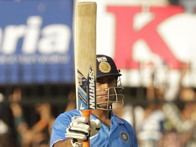 MS Dhoni celebrates his half century during India’s first innings score of 247. (Anshuman Poyrekar/HT Photo)