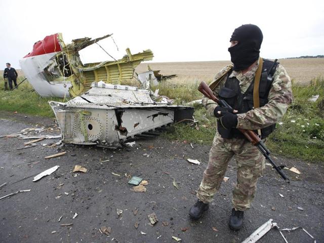 A pro-Russian separatist stands at the crash site of Malaysia Airlines flight MH17, near the settlement of Grabovo in the Donetsk region. (Reuters File Photo) A pro-Russian separatist stands at the crash site of Malaysia Airlines flight MH17, near the settlement of Grabovo in the Donetsk region. (Reuters File Photo)