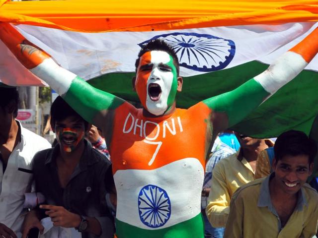 Cricket fans painted their face and body with the tricolour to support the Indian team. (Shankar Mourya/HT Photo)