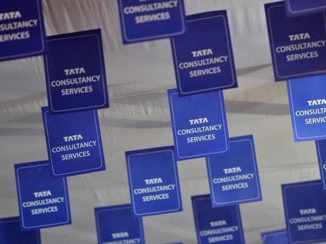 Logos of Tata Consultancy Services (TCS) are displayed at the venue of the annual general meeting of the software services provider in Mumbai. (Reuters file photo) Logos of Tata Consultancy Services (TCS) are displayed at the venue of the annual general meeting of the software services provider in Mumbai. (Reuters file photo)