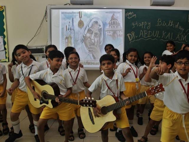 School students sing on the occasion of former President the late Dr APJ Abdul Kalam’s birthday at Thane on Thursday.  (Praful Gangurde) 