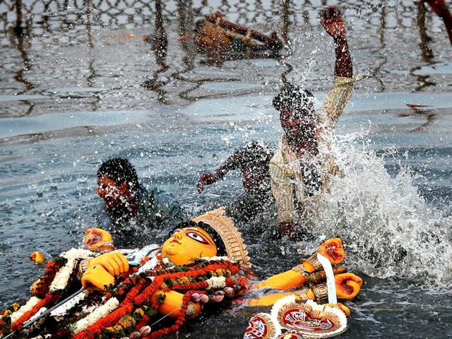 The Pollution control board order calls for removal and disposal of left over materials like flowers, decorations, clothes within 48 hours of immersion from the immersion sites(AP File Photo) The Pollution control board order calls for removal and disposal of left over materials like flowers, decorations, clothes within 48 hours of immersion from the immersion sites(AP File Photo)