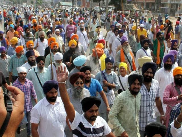 In Moga city, the protest march started from Gurudwara Bibi Kann Kaur and agitators held a dharna at Main Chowk on Ludhiana-Ferozepur road. (JS Grewal/HT)