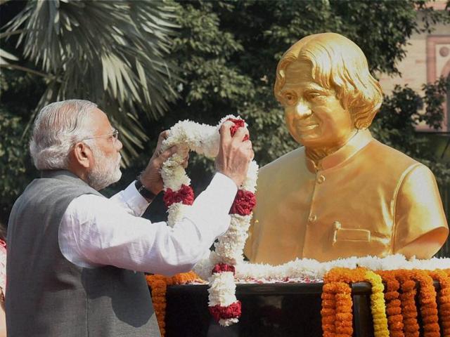 PM Narendra Modi pays tributes to former President APJ Abdul Kalam, on his 84th birth anniversary, at DRDO Bhawan in New Delhi. (PTI Photo)