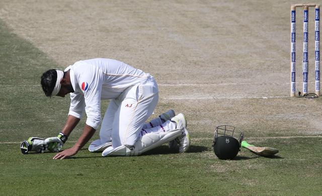 Pakistan's Shoaib Malik celebrates after reaching his double century. (Reuters Photo)