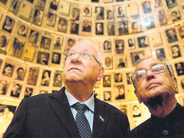 President Pranab Mukherjee looks at pictures of those killed during the Holocaust in the Hall of Names in Jerusalem on Tuesday. (PTI Photo) President Pranab Mukherjee looks at pictures of those killed during the Holocaust in the Hall of Names in Jerusalem on Tuesday. (PTI Photo)