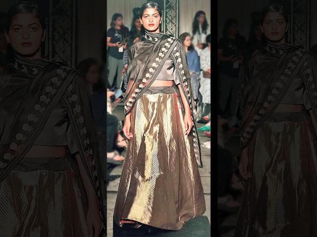 If you want the complete combo with dupatta, this is how you wear it. Designer Sanjay Garg uses black and grey with a metallic tone to create this glamorous, modern-day lehenga look.