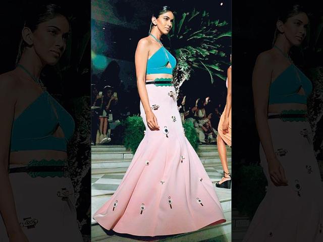 Designer duo Shivan and Narresh played with muted tones of pink and green. A halter blouse with a sexy cut-out paired with a fishtail skirt with appliqué work is perfect for a cocktail party.