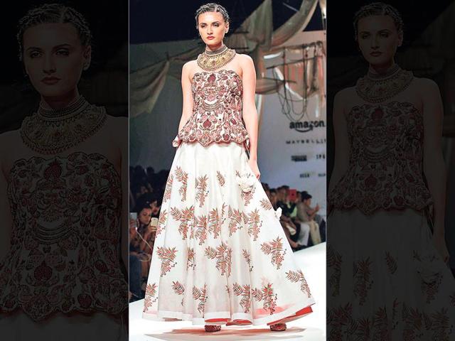 Go for printed lehengas with embroidered cholis to balance the look. This corset blouse over a leaf-print lehenga by designer Samant Chauhan is a perfect example.
