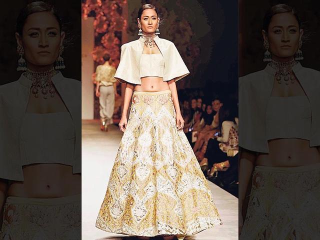 Take your love for capes a level higher. Wear a cape-style blouse over your lehenga, as seen on designer Siddhartha Tytler’s runway, to make a chic style statement.