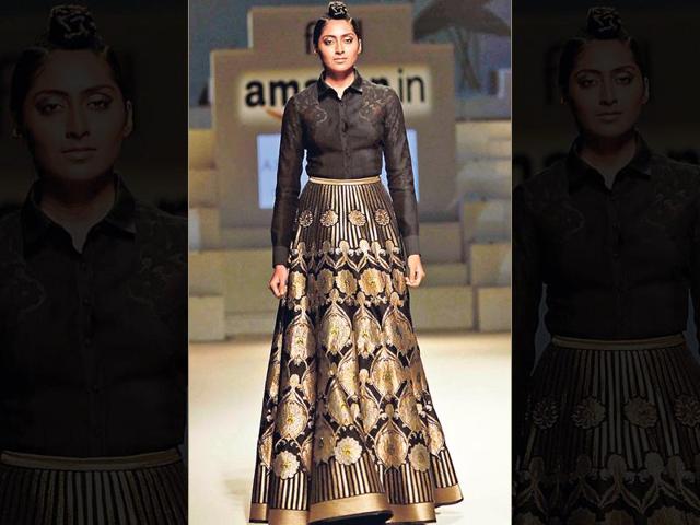 Wearing shirts over lehengas is as cool as it can get. This creation by designer Abhishek Gupta of a buttoned-up, tucked-in shirt with a metallic lehenga is bang on.