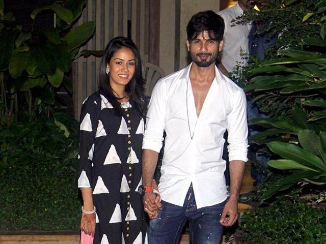 Mira and Shahid Kapoor pose for images as they reach their Mumbai residence after their Delhi wedding. (Twitter) Mira and Shahid Kapoor pose for images as they reach their Mumbai residence after their Delhi wedding. (Twitter)
