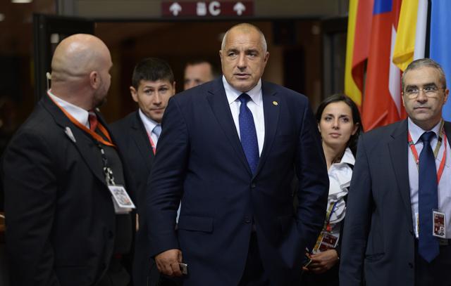 Bulgaria's Prime Minister Boyko Borissov leaves after an European Council leaders' summit on the migration crisis. Borissov had to fly back home after an Afghan migrant was shot and killed by police trying. (AFP Photo)