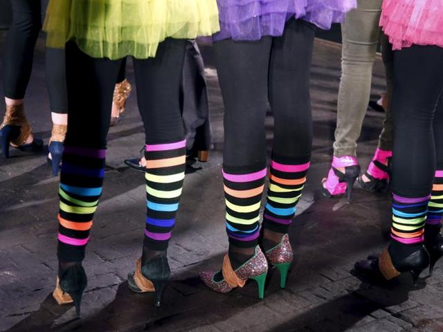 Contestants were seen take precautions for a high heels race in Paris. (REUTERS)