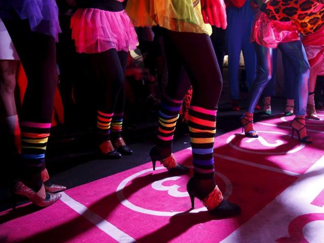 Contestants prepare to start in a high heels race in Paris. (REUTERS)