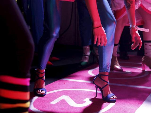 Contestants ready to compete in a 3x60 meter relay to win 3,000 Euros worth of shoes. (REUTERS)