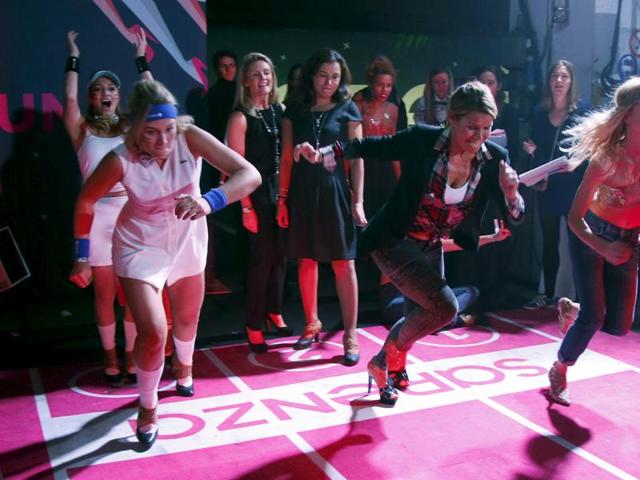 Each team comprised of three girls racing in high heels. (REUTERS)