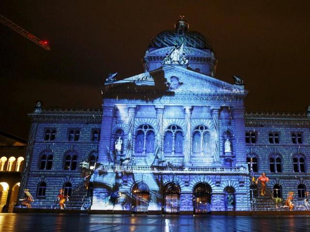 The Swiss Federal Palace (Bundeshaus) is illuminated by giant light projection The Jewel of the Mountains in Bern, Switzerland. (REUTERS)