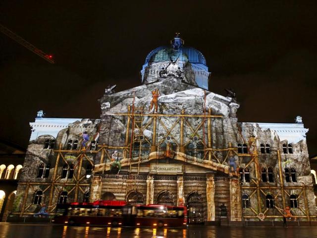 The Swiss Federal Palace (Bundeshaus) illuminated by giant light projection The Jewel of the Mountains in Bern, Switzerland October 15, 2015. (REUTERS)