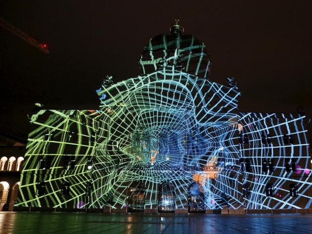The Swiss Federal Palace (Bundeshaus) is illuminated by giant light projection. (REUTERS)