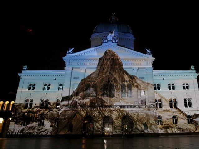 The Swiss Federal Palace (Bundeshaus) is illuminated by a giant light projection of the Matterhorn. (REUTERS)