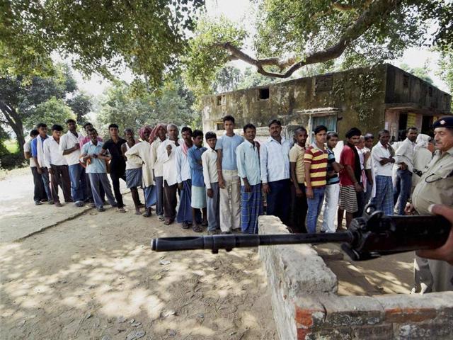 Voters cast their votes at a polling station in Makhdumpur. The polling percentage was 46.99% till 2pm in the afternoon, with large number of people turning up despite the Maoists’ threat . (PTI Photo)