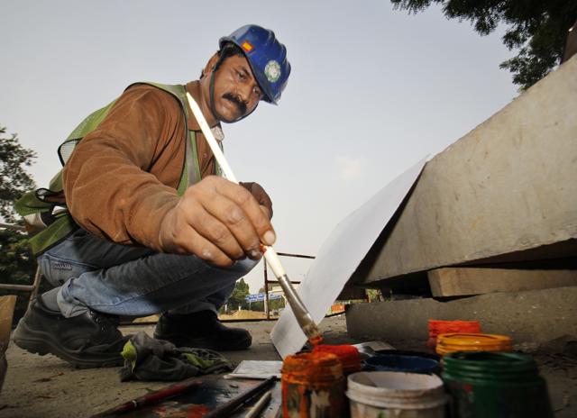The slogans were devised, refined and painted by the Metro workers themselves as they continue to extend the lines in New Delhi. (Sanchit Khanna/ HT Photo) The slogans were devised, refined and painted by the Metro workers themselves as they continue to extend the lines in New Delhi. (Sanchit Khanna/ HT Photo)