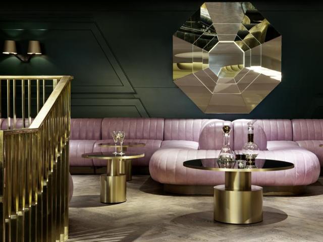 Pink leather banquettes and a marble green bar are used to create a distinctive drinking experience at the Dandelyan bar at the Mondrian hotel in London. (AFP)
